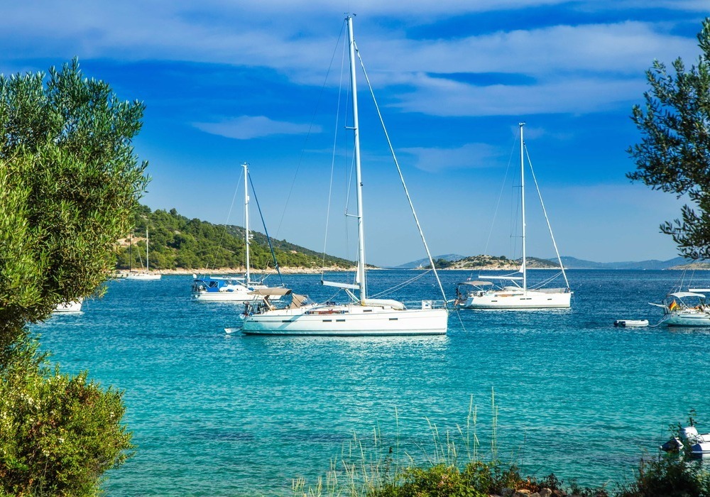 Catamarans in azure bay
